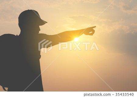 silhouette of a tourist man  Pointing forward  35433540