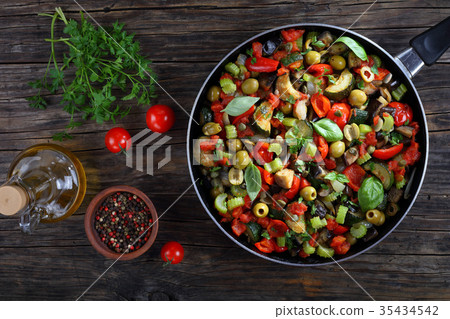 tasty Caponata with vegetables on skillet tasty Caponata with vegetables on skillet 35434542