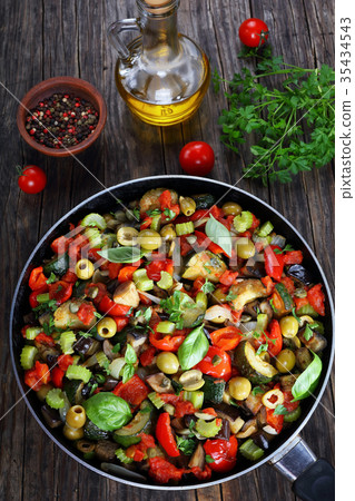 tasty Caponata with vegetables on skillet 35434543