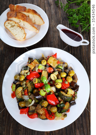 tasty Caponata with vegetables on plate 35434546