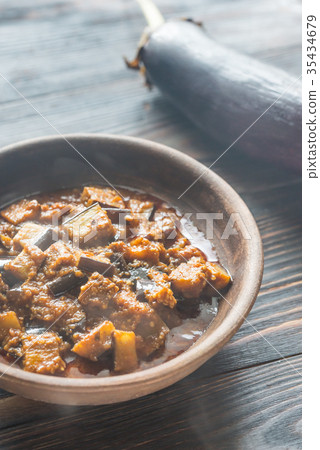 Bowl of aubergine with rogan josh sauce 35434679