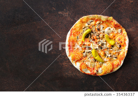 Homemade pizza. Top view with copy space on dark Homemade pizza. Top view with copy space on dark 35436337
