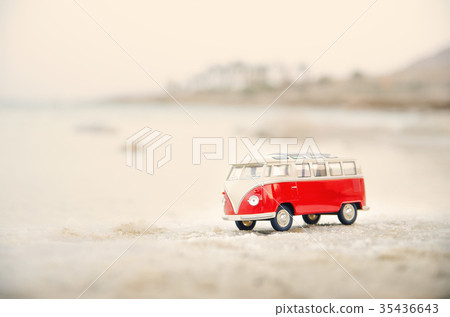 Toy car, model bus park in the sand near sea 35436643