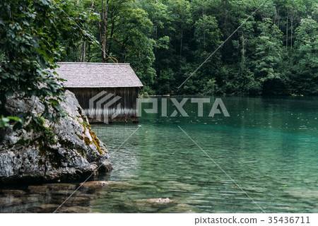 Wooden cottage in beautiful lake in the Alps with Wooden cottage in beautiful lake in the Alps with 35436711