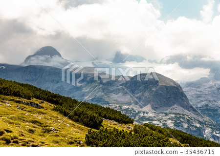 Scenic view of alps mountains a sunny day Scenic view of alps mountains a sunny day 35436715