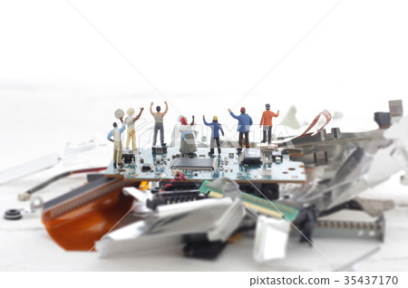 Remnants of a computer and a miniature human figure 35437170