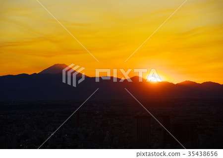 Sunset with sun and sun dyed in golden yellow with Fuji from Roppongi, Tokyo time series a 35438656