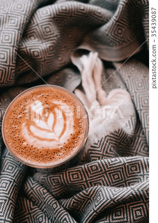 Latte art coffee on warm scarf blanket Latte art coffee on warm scarf blanket 35439087