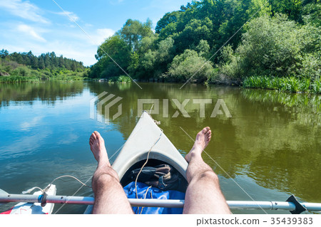 A man relaxing on kayak 35439383