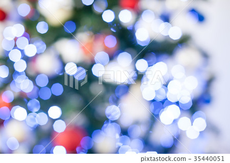 Bokeh Christmas tree with red gifts in the white Bokeh Christmas tree with red gifts in the white 35440051