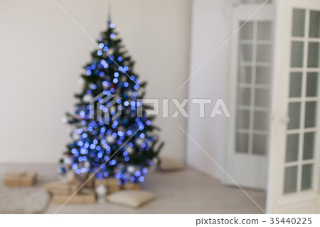 Bokeh Christmas tree with red gifts in the white 35440225