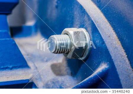 Close up metal nut on bolt 35440240