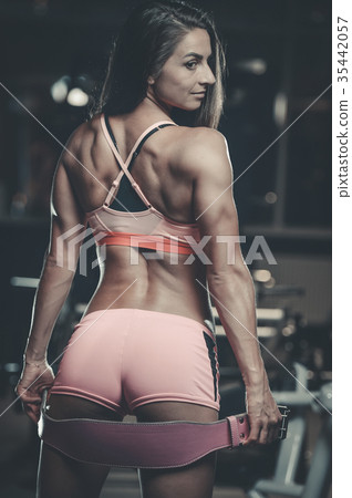 Sexy Athletic Girl Working Out In Gym. Sexy Butt In Thong Stock