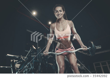 Sexy athletic young girl training back in gym 35442092