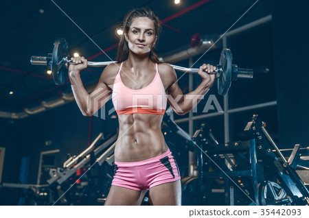 Sexy athletic young girl training legs in gym 35442093