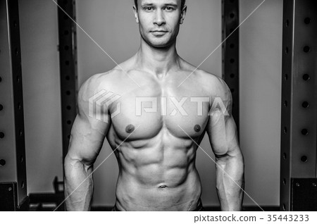 Attractive model young man training in gym 35443233