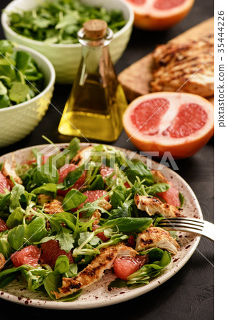 Grilled chicken and grapefruit salad. 35444226