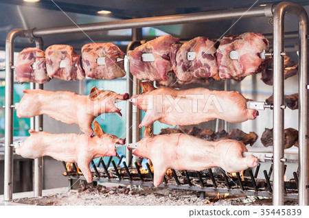 Carcasses of pork and other meat prepare on skewer 35445839
