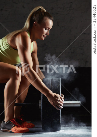 Female crossfit athlete exercising Female crossfit athlete exercising 35446525