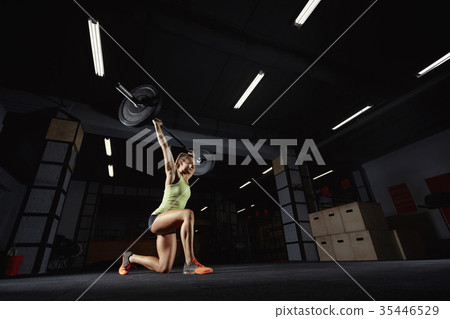 Female crossfit athlete exercising 35446529