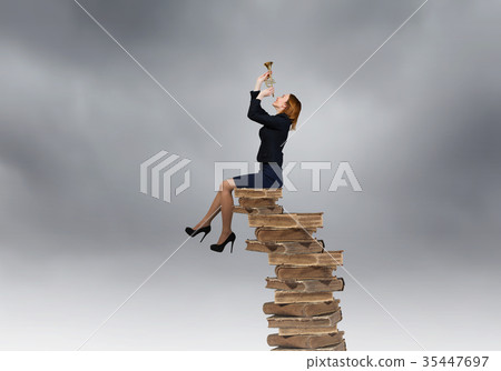 Woman speaking in horn Woman speaking in horn 35447697