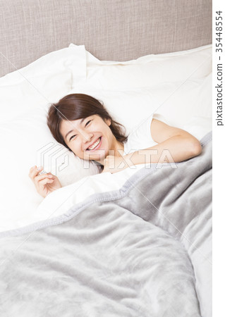 A woman with a thermometer A woman with a thermometer 35448554