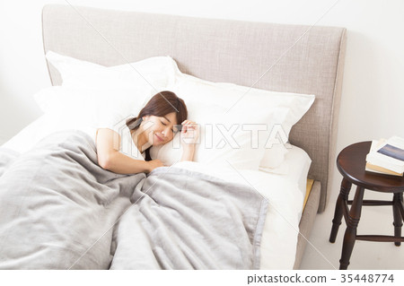 Woman sleeping in bed Woman sleeping in bed 35448774