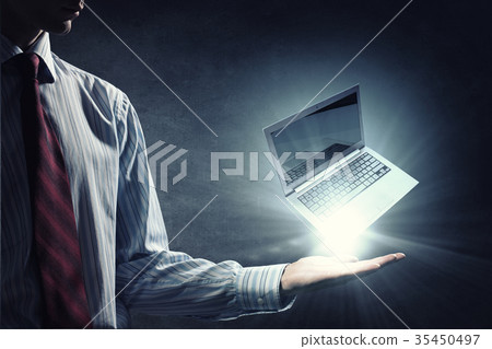 Laptop in hand Laptop in hand 35450497