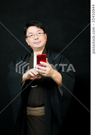 Middle man (kimono, smartphone) 35450944