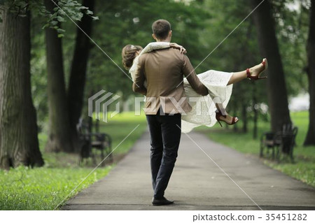Wedding dance in the park of young bride and groom Wedding dance in the park of young bride and groom 35451282