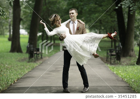 Wedding dance in the park of young bride and groom Wedding dance in the park of young bride and groom 35451285