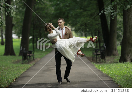Wedding dance in the park of young bride and groom Wedding dance in the park of young bride and groom 35451288