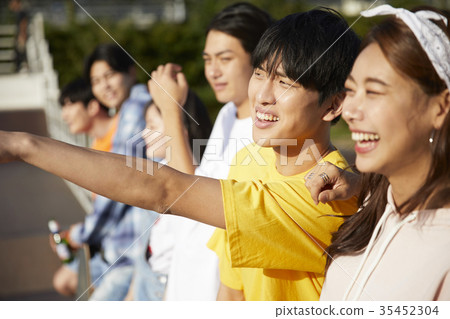 Young man, young woman, cheers Young man, young woman, cheers 35452304