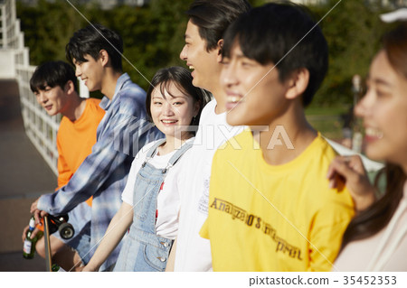 Young man, young woman, cheers Young man, young woman, cheers 35452353