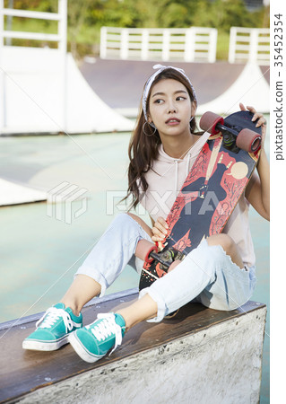 Young woman, skateboarding Young woman, skateboarding 35452354