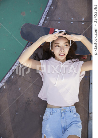 Young woman, skateboarding Young woman, skateboarding 35452363