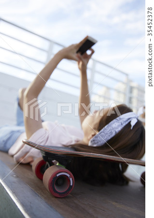 Young woman, skateboarding Young woman, skateboarding 35452378