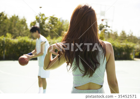 Young man, young woman, basketball, sports Young man, young woman, basketball, sports 35452571