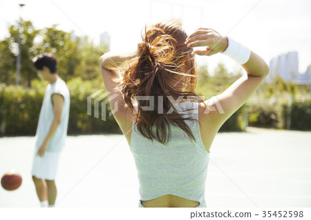 Young man, young woman, basketball, sports Young man, young woman, basketball, sports 35452598