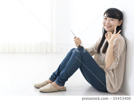 Young Woman Working With Tablet OK Sign 35453400