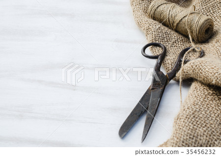 Old scissors, skein jute twine and burlap. Old scissors, skein jute twine and burlap. 35456232