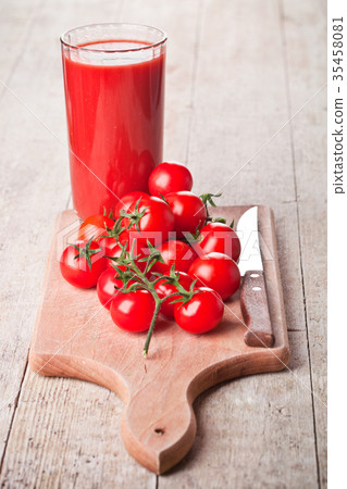 tomato juice in glass and fresh tomatoes tomato juice in glass and fresh tomatoes 35458081
