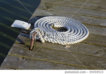 nautical mooring rope on wooden pier nautical mooring rope on wooden pier 35459513