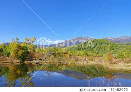 Autumn Myomeno Pond and Mt. Norikura Autumn Myomeno Pond and Mt. Norikura 35462073