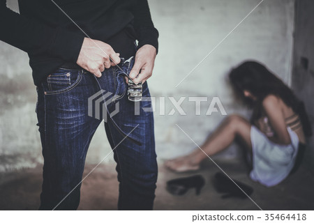 Thief robber swiping zip of pants after rape woman - Stock Photo 35464418  picture