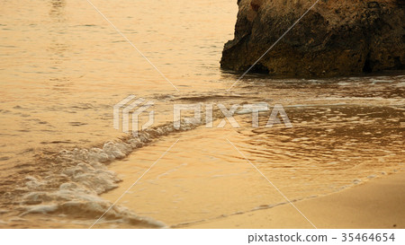 Soft sea waves rushing at the sunset 35464654