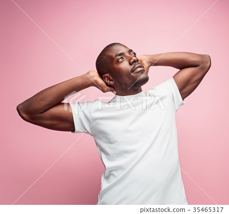 Positive thinking African-American man on pink 35465317