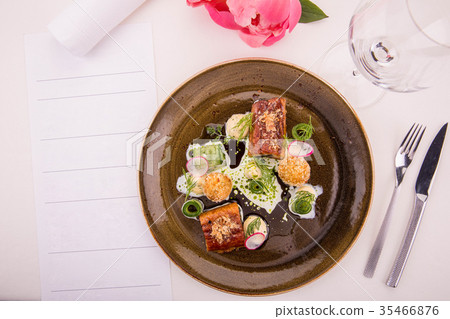 The eel glazed in kvass croquet from cottage chees 35466876