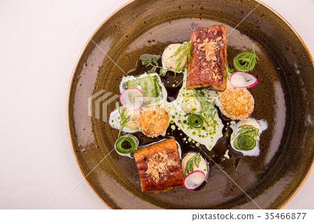 The eel glazed in kvass with croquet from cottage  35466877