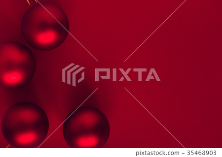 Red Christmas balls on red background Red Christmas balls on red background 35468903
